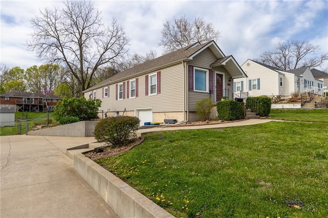 view of side of home with a lawn and concrete driveway