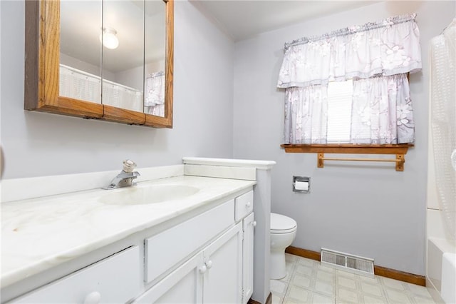 bathroom with tile patterned floors, vanity, baseboards, toilet, and visible vents