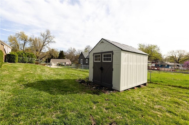 view of shed featuring a fenced backyard