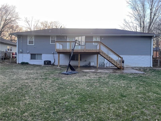 rear view of house with a yard, central air condition unit, a deck, and stairs