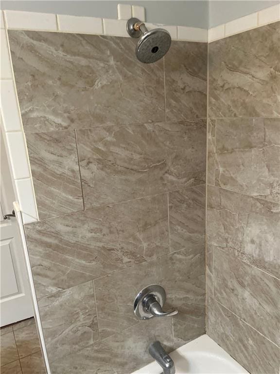 room details featuring shower / tub combination