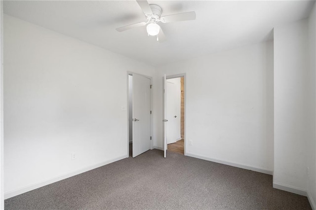 4001 E 55th St, Kansas City, MO 64130 - spare room featuring ceiling fan, baseboards, and carpet