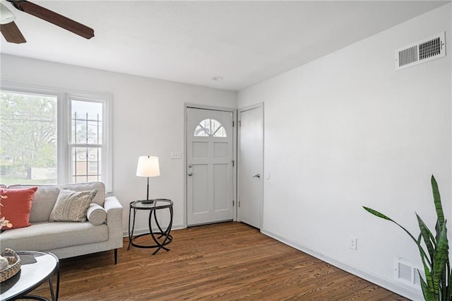 4001 E 55th St, Kansas City, MO 64130 - entryway featuring ceiling fan, baseboards, wood finished floors, and visible vents