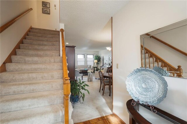 327 E Partridge Ave, Independence, MO 64055 - stairway with a textured ceiling