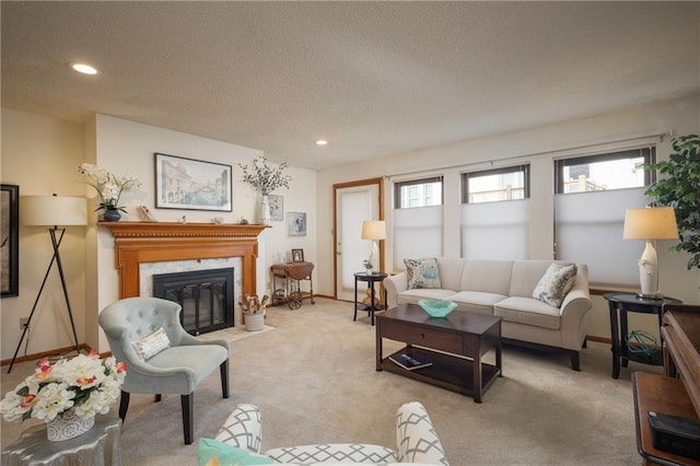 327 E Partridge Ave, Independence, MO 64055 - carpeted living room with a premium fireplace, recessed lighting, baseboards, and a textured ceiling
