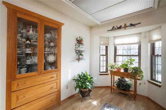 327 E Partridge Ave, Independence, MO 64055 - doorway featuring baseboards and light wood finished floors