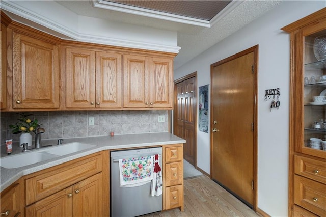 327 E Partridge Ave, Independence, MO 64055 - kitchen with tasteful backsplash, dishwasher, light countertops, and a sink