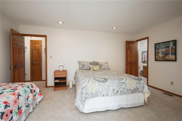 327 E Partridge Ave, Independence, MO 64055 - bedroom featuring visible vents, baseboards, light colored carpet, and a textured ceiling
