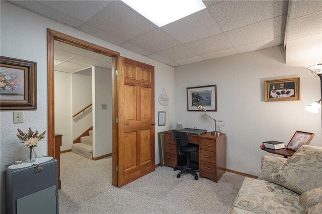 327 E Partridge Ave, Independence, MO 64055 - office area with baseboards, a paneled ceiling, and light colored carpet