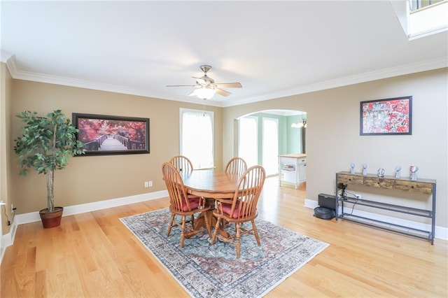 4373 Hackberry Ln, Bates City, MO 64011 - dining area with arched walkways, light wood-style floors, baseboards, and ornamental molding