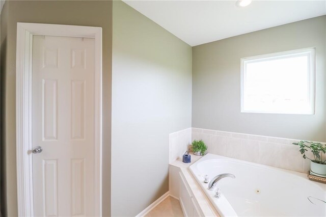 4373 Hackberry Ln, Bates City, MO 64011 - bathroom with a jetted tub and baseboards