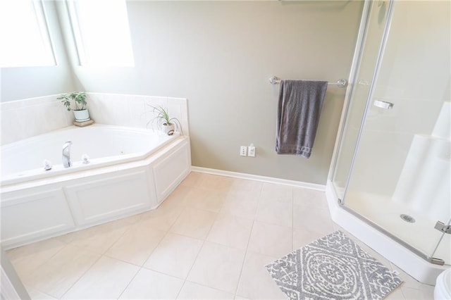 4373 Hackberry Ln, Bates City, MO 64011 - bathroom with a stall shower, a garden tub, tile patterned floors, and baseboards
