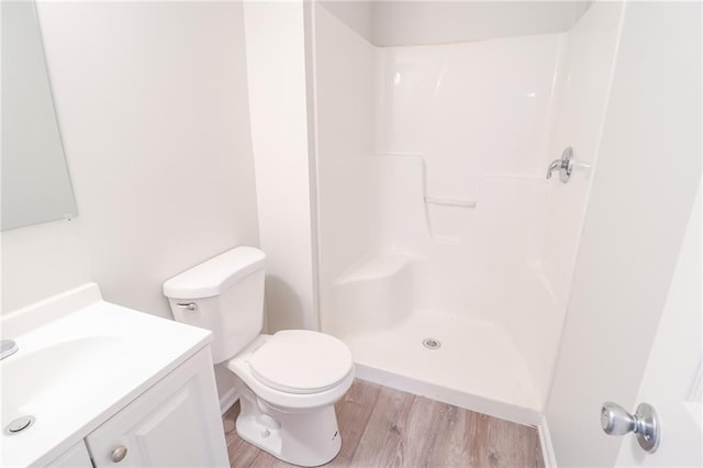 4373 Hackberry Ln, Bates City, MO 64011 - full bath featuring wood finished floors, a shower, vanity, and toilet