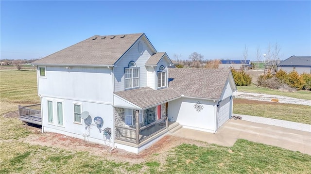 4373 Hackberry Ln, Bates City, MO 64011 - view of front of home with driveway, a shingled roof, a front lawn, covered porch, and a garage