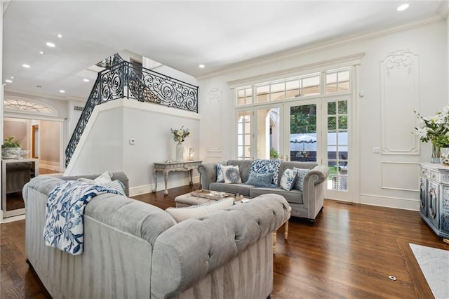 living room featuring crown molding, recessed lighting, dark wood finished floors, and stairway