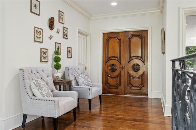 sitting room with baseboards, ornamental molding, recessed lighting, and wood finished floors