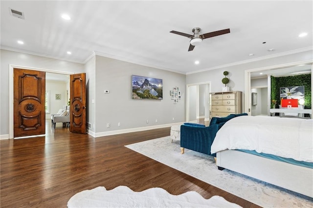 bedroom with recessed lighting, baseboards, wood finished floors, visible vents, and ornamental molding