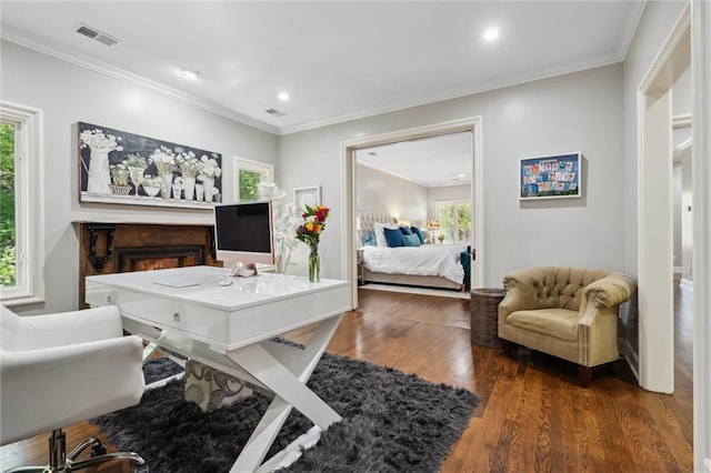 office space with visible vents, ornamental molding, wood finished floors, and recessed lighting