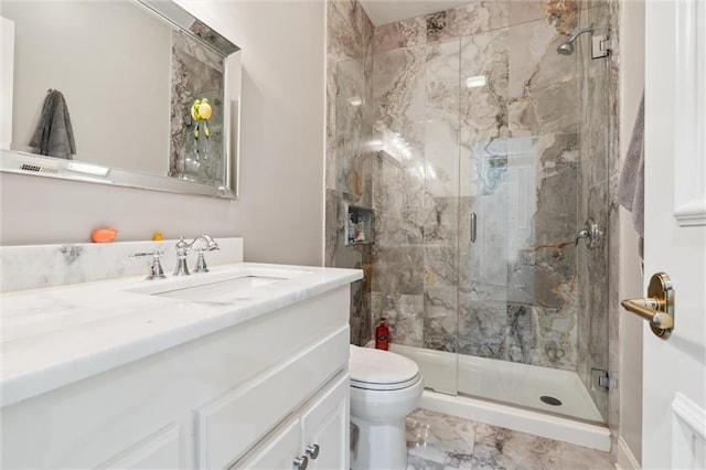 full bath featuring vanity, marble finish floor, a marble finish shower, and toilet