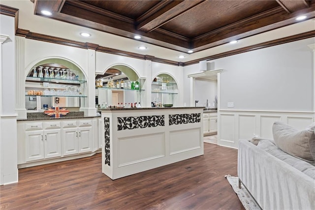 kitchen with ornamental molding, coffered ceiling, dark wood finished floors, and white cabinets