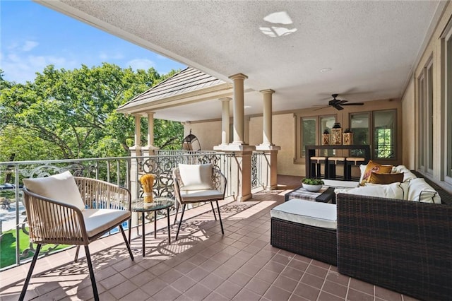 view of patio / terrace featuring ceiling fan, outdoor lounge area, and a balcony
