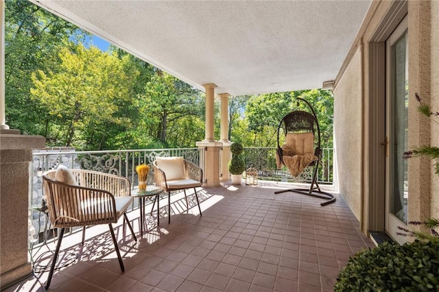 view of patio / terrace with a balcony