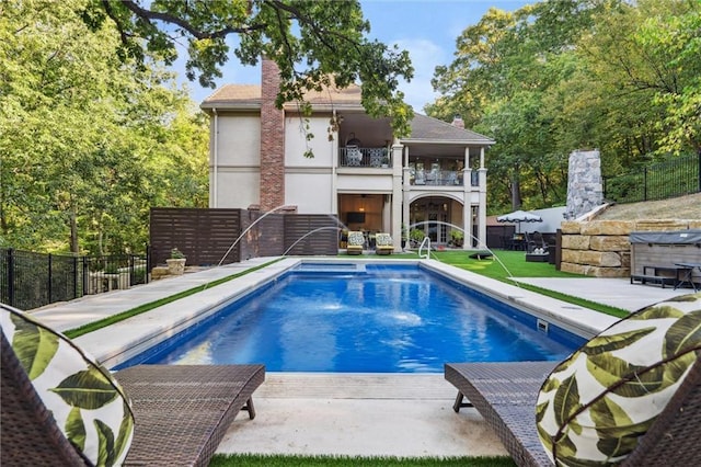 view of pool with a fenced in pool, fence, and a patio