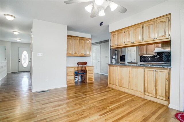 22804 E 28th Terrace Ct, Blue Springs, MO 64015 - kitchen featuring stainless steel fridge, light wood-style flooring, a ceiling fan, and decorative backsplash