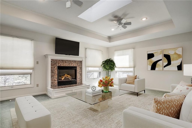 22804 E 28th Terrace Ct, Blue Springs, MO 64015 - living area with a ceiling fan, carpet flooring, ornamental molding, a fireplace, and recessed lighting