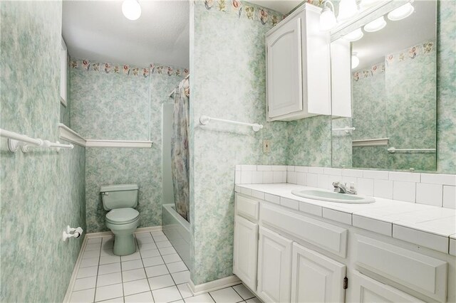 22804 E 28th Terrace Ct, Blue Springs, MO 64015 - bathroom with tile patterned flooring, toilet, vanity, shower / bathtub combination with curtain, and wallpapered walls