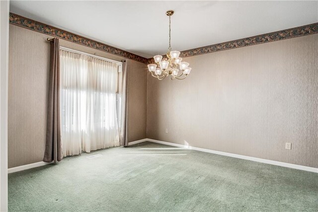 22804 E 28th Terrace Ct, Blue Springs, MO 64015 - unfurnished room with carpet and a chandelier
