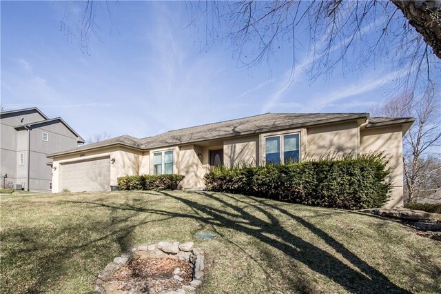 22804 E 28th Terrace Ct, Blue Springs, MO 64015 - single story home featuring stucco siding, an attached garage, and a front lawn