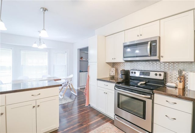 308 Acorn Pl, Warrensburg, MO 64093 - kitchen featuring stainless steel appliances, dark wood-style floors, decorative backsplash, a chandelier, and white cabinets