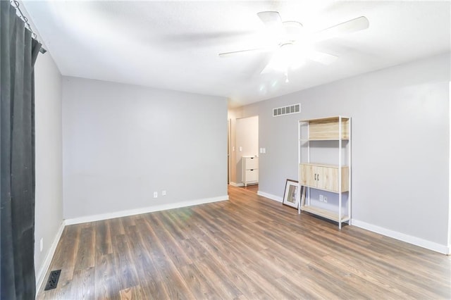 308 Acorn Pl, Warrensburg, MO 64093 - empty room with wood finished floors and a ceiling fan