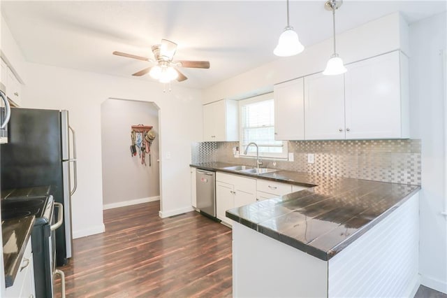 308 Acorn Pl, Warrensburg, MO 64093 - kitchen with stainless steel dishwasher, electric range oven, a peninsula, a ceiling fan, and dark wood-style floors