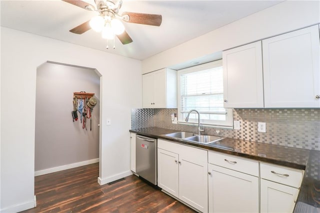 308 Acorn Pl, Warrensburg, MO 64093 - kitchen with stainless steel dishwasher, dark wood-style flooring, backsplash, and white cabinets