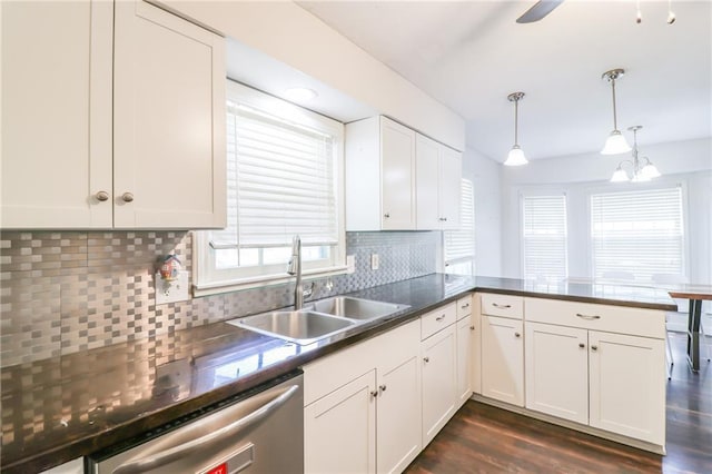 308 Acorn Pl, Warrensburg, MO 64093 - kitchen with dishwasher, backsplash, white cabinetry, hanging light fixtures, and dark wood finished floors