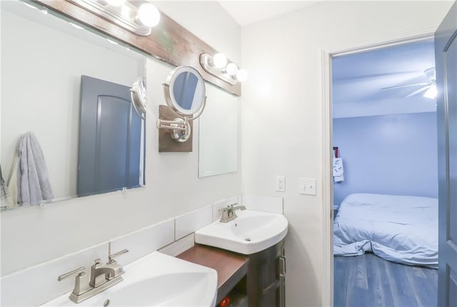 308 Acorn Pl, Warrensburg, MO 64093 - ensuite bathroom featuring double vanity and wood finished floors