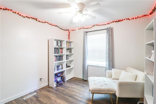 308 Acorn Pl, Warrensburg, MO 64093 - sitting room featuring a ceiling fan and dark wood-style floors