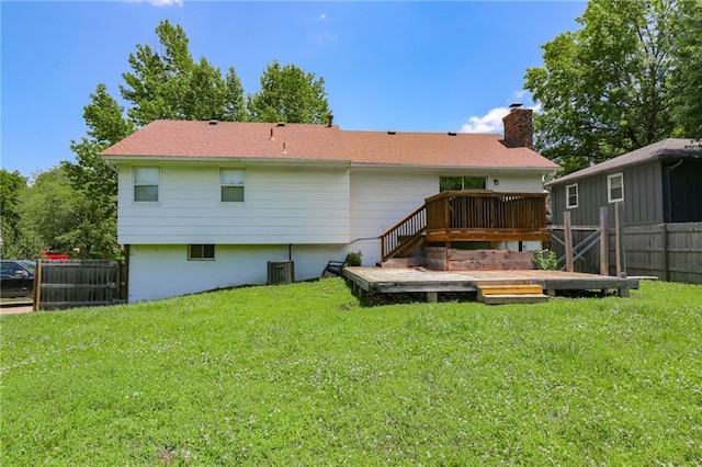 308 Acorn Pl, Warrensburg, MO 64093 - back of property featuring a deck and a chimney