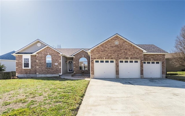 ranch-style home with brick siding, fence, concrete driveway, a front yard, and an attached garage