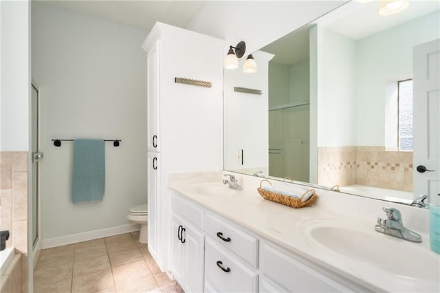 full bathroom with tile patterned flooring, toilet, a stall shower, and a sink