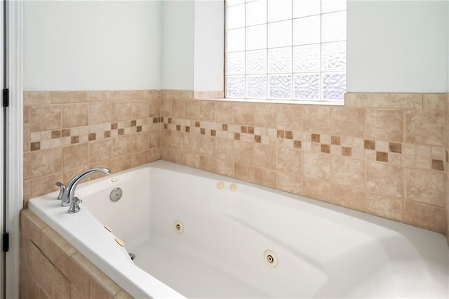 full bath with a tub with jets