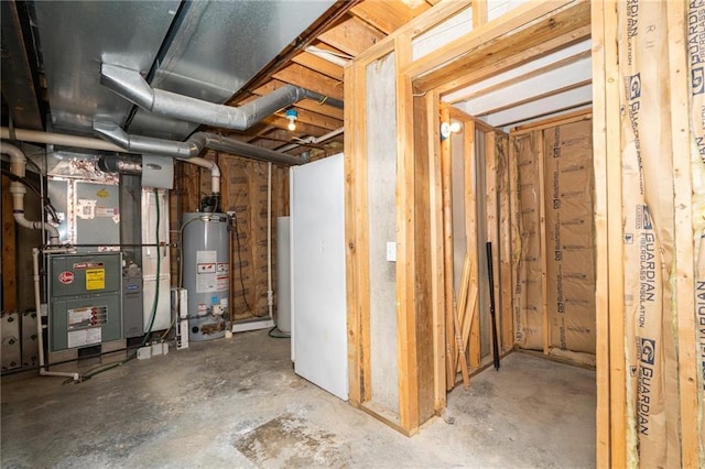 unfinished basement with heating unit and gas water heater