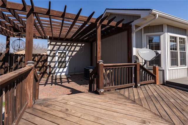 wooden deck with fence and a pergola