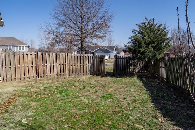 view of yard with a fenced backyard