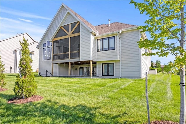 12313 W 169th St, Overland Park, KS 66221 - rear view of property with a sunroom and a lawn
