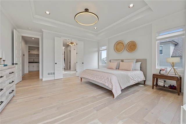 12313 W 169th St, Overland Park, KS 66221 - bedroom with a raised ceiling, light wood-style floors, recessed lighting, a chandelier, and ornamental molding