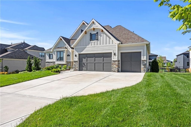 12313 W 169th St, Overland Park, KS 66221 - view of front of home featuring board and batten siding, driveway, a garage, a front yard, and stone siding