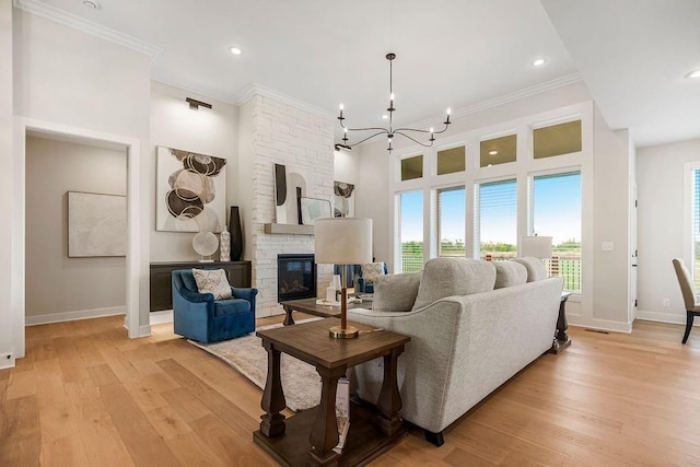 13021 W 174th Pl, Overland Park, KS 66221 - living room with baseboards, ornamental molding, plenty of natural light, a chandelier, and recessed lighting